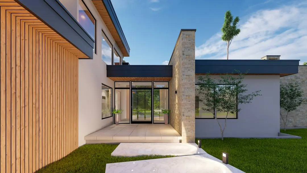 Casă modernă tip barndominium: 3 dormitoare și verandă generoasă